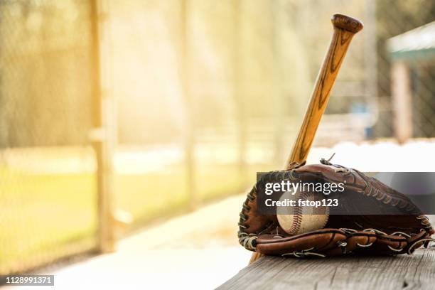 baseball season is here. bat, glove and ball on dugout bench. - banco dos jogadores imagens e fotografias de stock