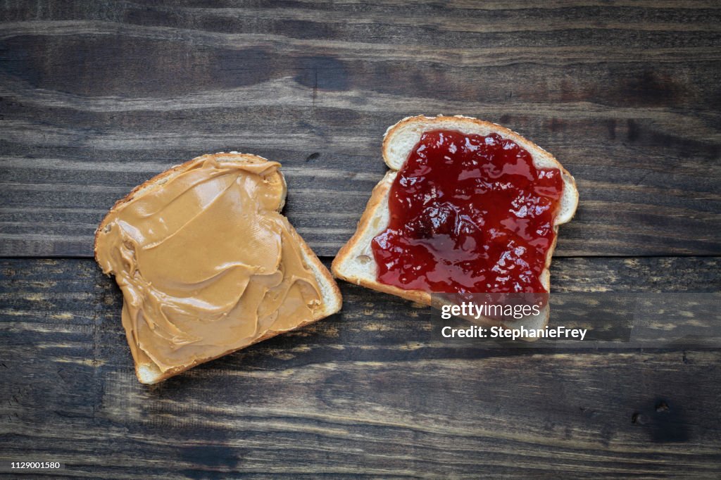 Open face homemade peanut butter and strawberry Jelly sandwich