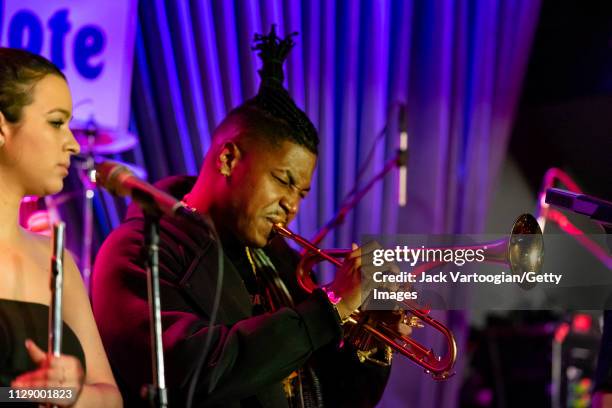 American bandleader, composer, and trumpet player Christian Scott plays trumpoet performs with his septet at the Blue Note, New York, New York,...