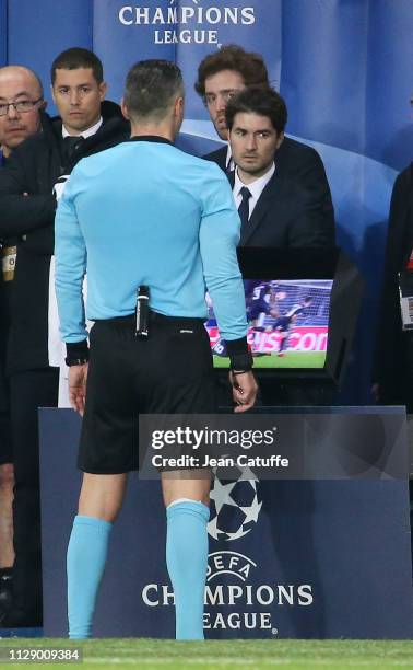 Referee Damir Skomina of Slovenia uses the VAR for a penalty for Manchester United at the last minute of the match during the UEFA Champions League...