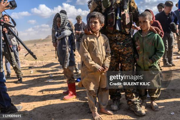 Children believed to be from the Yazidi community, who were captured by Islamic State group fighters, are pictured after being evacuated from the IS'...