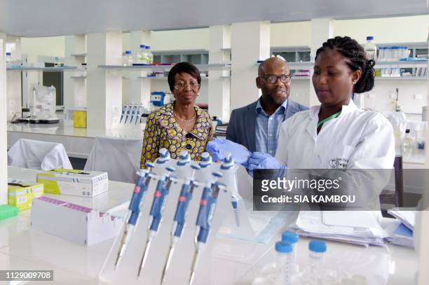 Ramata Ly-Bakayoko , Minister of Women Affairs and Ivorian Premier at the Paris Academy of Sciences Overseas listens to a researcher as she visits...