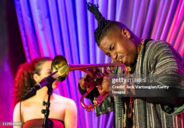 American bandleader, composer, and trumpet player Christian Scott plays trumpoet performs with his septet at the Blue Note, New York, New York,...