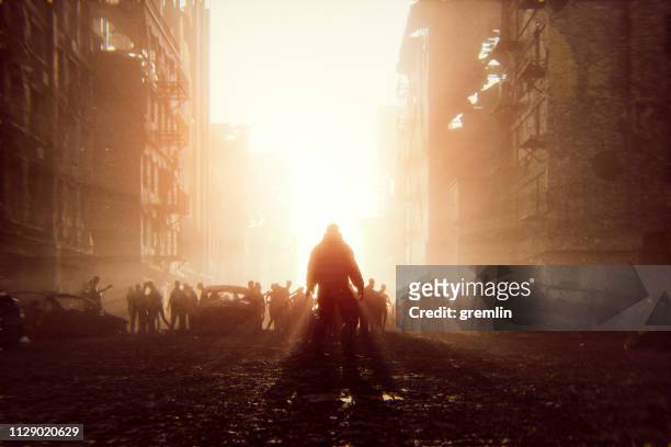 zombie apokalypse überlebender gegen horden von untoten - doomsday stock-fotos und bilder