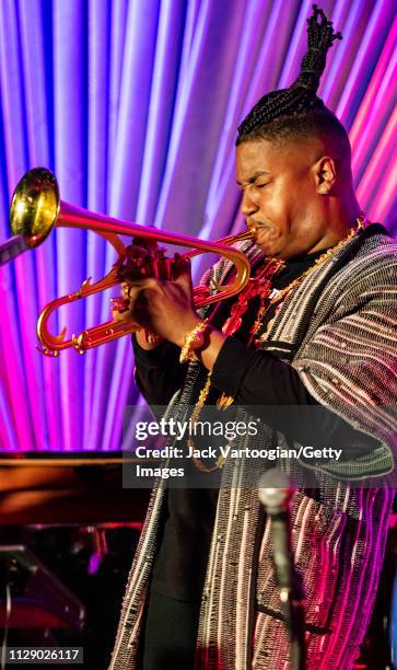 American bandleader, composer, and trumpet player Christian Scott plays trumpet as he performs with his septet at the Blue Note, New York, New York,...