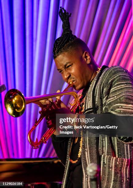 American bandleader, composer, and trumpet player Christian Scott plays trumpet as he performs with his septet at the Blue Note, New York, New York,...