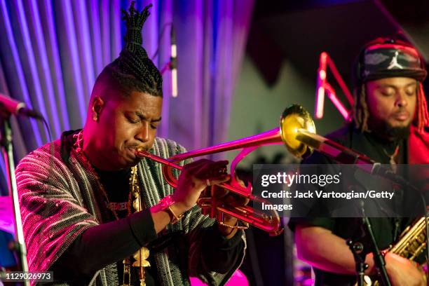 American bandleader, composer, and trumpet player Christian Scott plays trumpet as he performs with his septet at the Blue Note, New York, New York,...