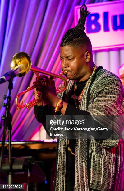 American bandleader, composer, and trumpet player Christian Scott plays trumpet as he performs with his septet at the Blue Note, New York, New York,...