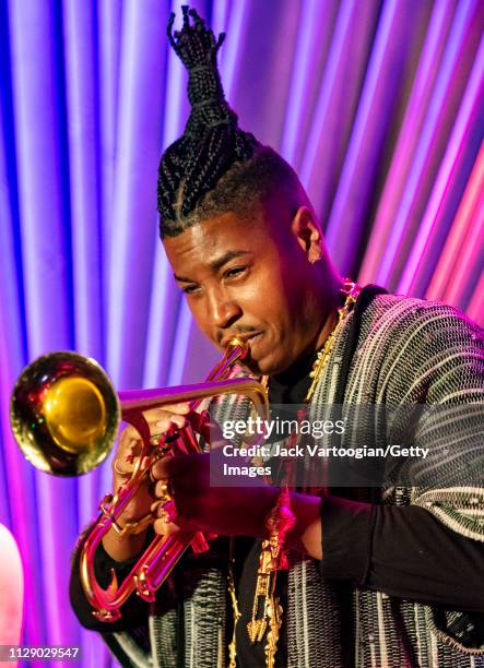 American bandleader, composer, and trumpet player Christian Scott plays trumpet as he performs with his septet at the Blue Note, New York, New York,...