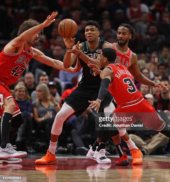 Giannis Antetokounmpo of the Milwaukee Bucks gets off a pass surrounded by Robin Lopez, Shaquille Harrison and Wayne Selden of the Chicago Bulls at...