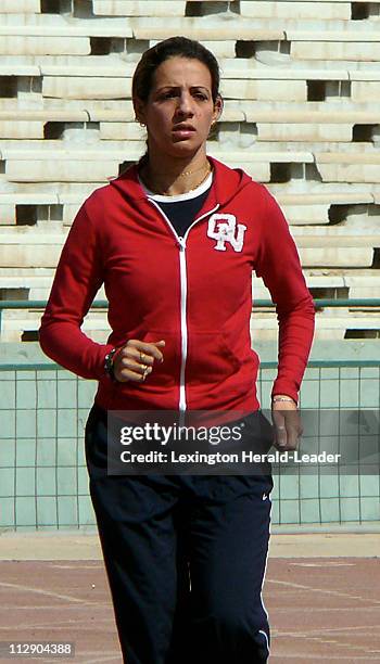 Iraqi sprinter and Olympic hopeful Dana Hussein jogs around the track at a stadium in Baghdad, Iraq. Hussein is a sprinter and an Iraqi athlete with...