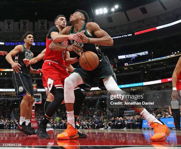 Zach LaVine of the Chicago Bulls knocks the ball away from Giannis Antetokounmpo of the Milwaukee Bucks at the United Center on February 11, 2019 in...