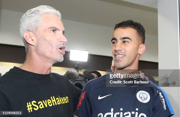 Refugee Bahraini footballer Hakeem al-Araibi walks with Craig Foster, former Australian football captain and commentator as he arrives at Melbourne...