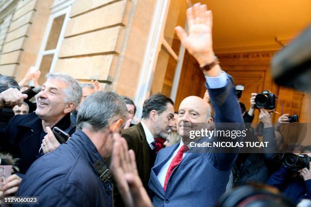 Former Bordeaux's mayor Alain Juppe waves as he says goodbye to Bordeaux's inhabitants at Bordeaux's city hall on March 7, 2019 in Bordeaux,...