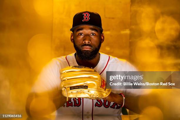 Jackie Bradley Jr. #19 of the Boston Red Sox poses for a portrait with the Gold Glove award during a team workout on February 27, 2019 at JetBlue...
