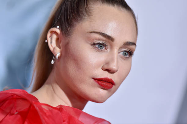 Miley Cyrus attends the premiere of Warner Bros. Pictures' 'Isn't It Romantic' at The Theatre at Ace Hotel on February 11, 2019 in Los Angeles,...