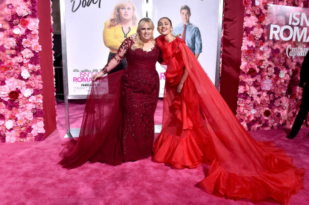 Rebel Wilson and Miley Cyrus attend the premiere of Warner Bros. Pictures' 'Isn't It Romantic' at The Theatre at Ace Hotel on February 11, 2019 in...