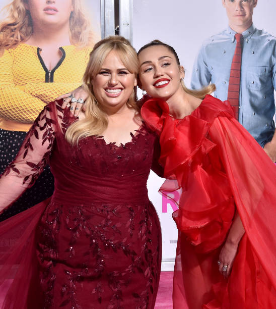 Rebel Wilson and Miley Cyrus attend the premiere of Warner Bros. Pictures' 'Isn't It Romantic' at The Theatre at Ace Hotel on February 11, 2019 in...