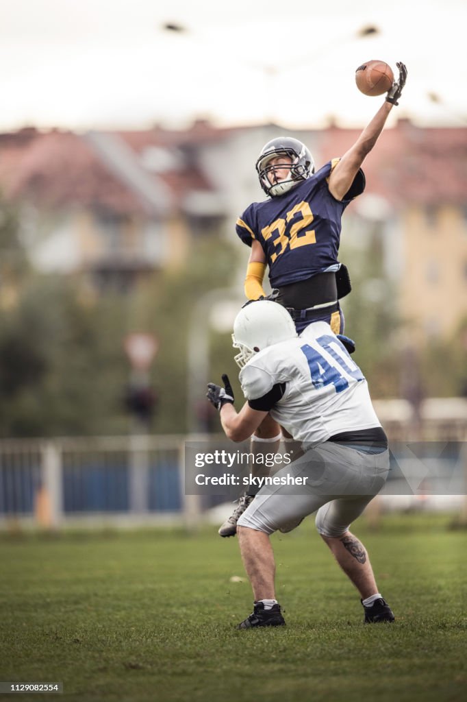 Catching the ball on American football match!