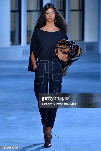 Model walks the runway at the 3.1 Phillip Lim Ready to Wear Fall/Winter 2019-2020 fashion show during New York Fashion Week on February 11, 2019 in...