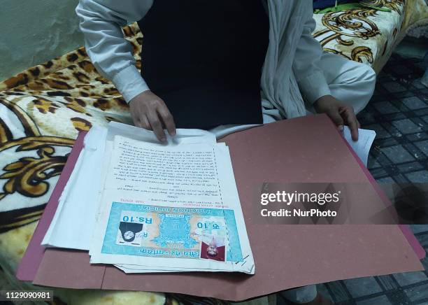 Tabassum bano , aged 30 years, an auto rickshaw driver woman, shows her divorce papers in her house , on the eve of International women's day , in...