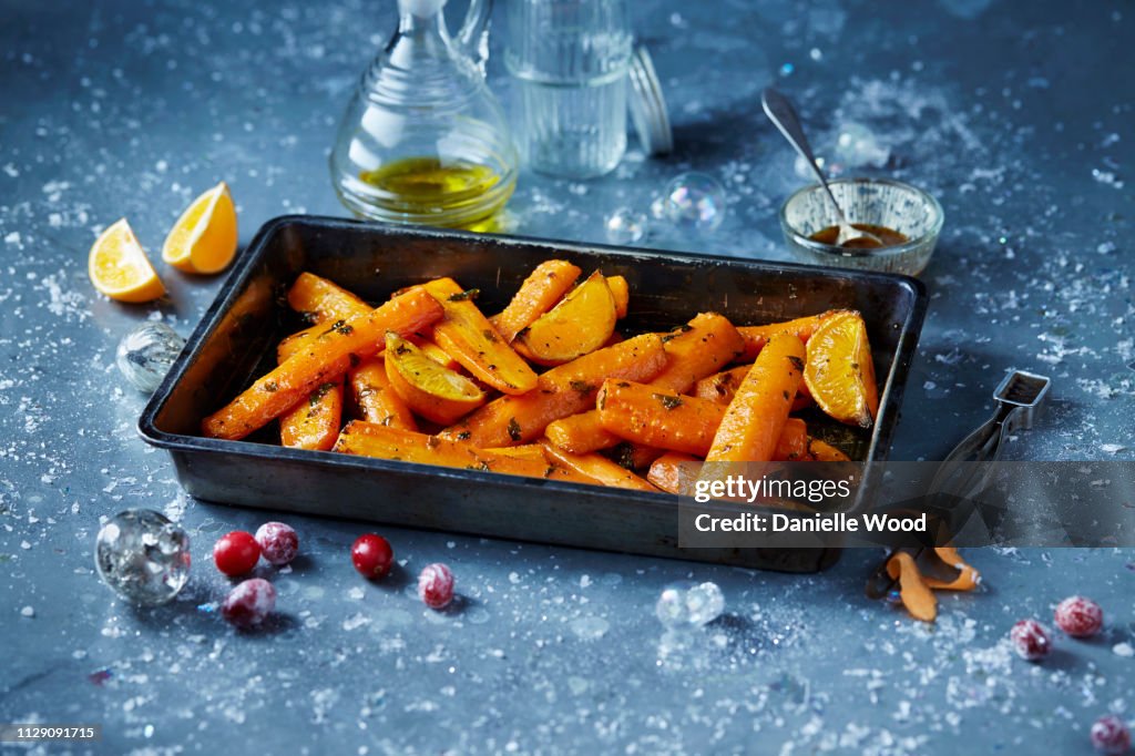 Roasted carrots in roasting tin, seasonal christmas food