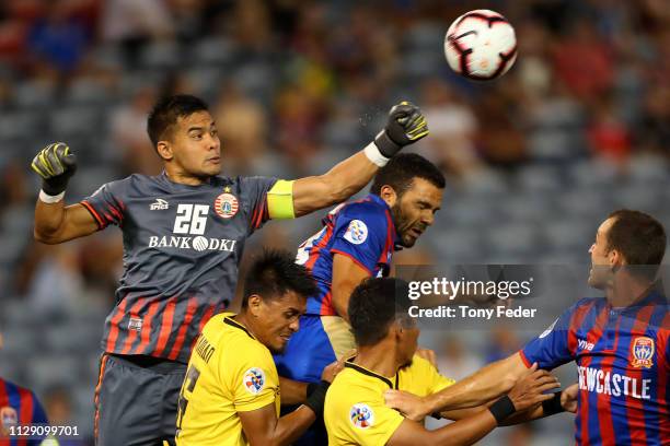 Andritany Ardhiyasa of Persija Jakarta contests the ball with Nikolai Topor-Stanley of the Newcastle Jets of the Newcastle Jets during the AFC...