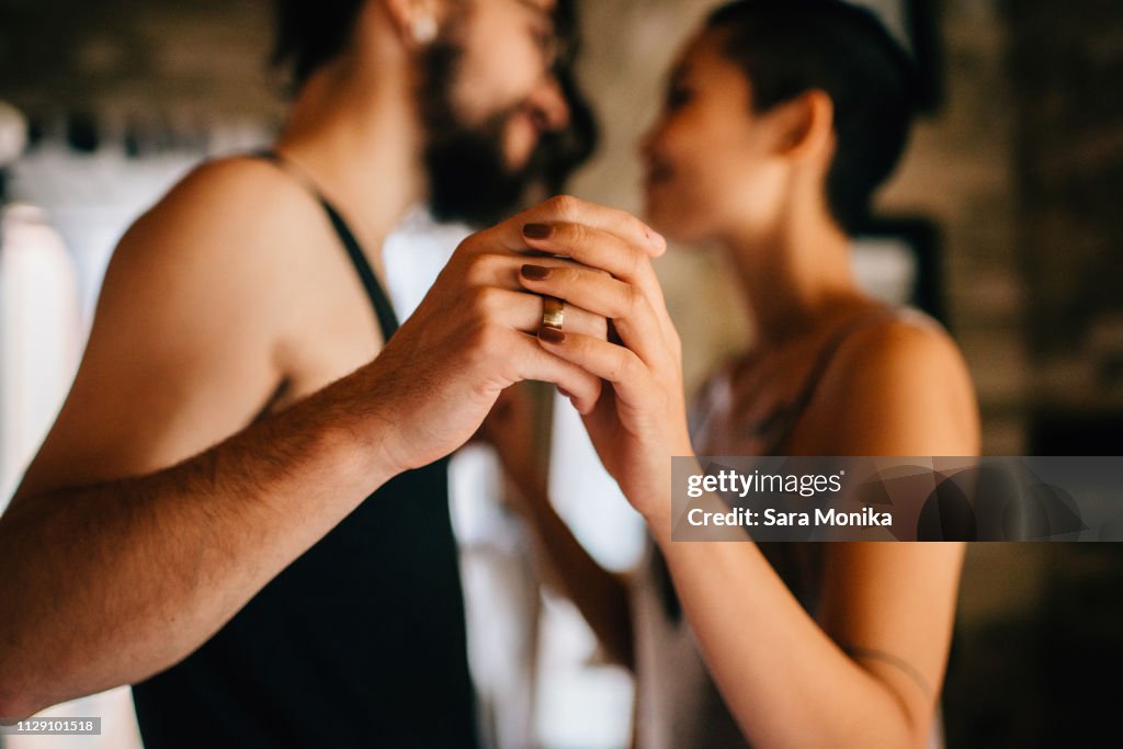 Couple slow dancing at home