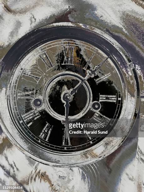 conceptual, close-up, distorted, distressed appearing vintage antique grandfather clock face with roman numeral numbers and hour and second hands. - roman numeral ten stock pictures, royalty-free photos & images