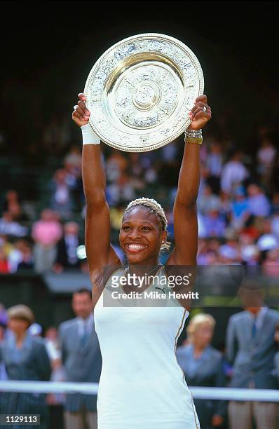 Wimbledon Ladies champion Serena Williams of the USA poses with the winning trophy at the Wimbledon Lawn Tennis Championship held at the All England...