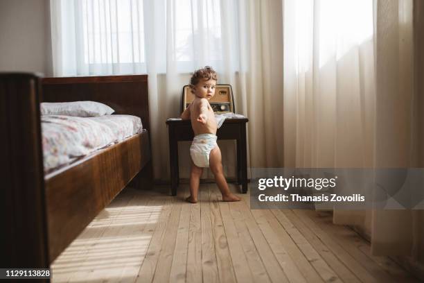 portait of a 1 year old boy - nappy stock pictures, royalty-free photos & images