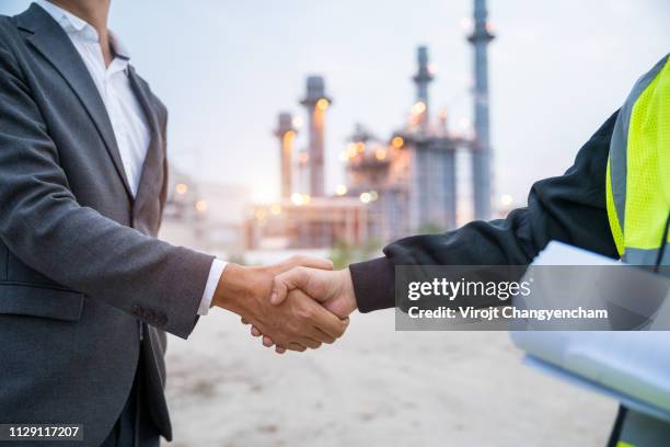 manager shake hands civil engineer at power plants - civil engineering fotografías e imágenes de stock