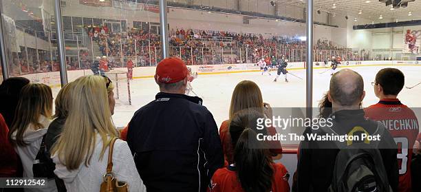 CApirtals fans form around the rink to watch the Washington Capitals practice for game 5, on Saturday, in the first round of the NHL playoffs agaisnt...