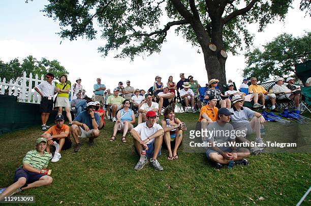 Fans and spectators gather outside the ropes on the 16th green during the final round of the Crowne Plaza Invitational at Colonial on Sunday, May 25...
