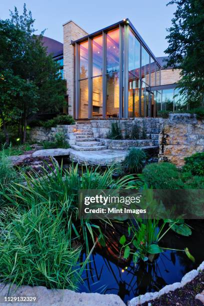 luxury home garden and pond - pont architecture stock pictures, royalty-free photos & images