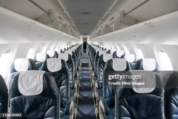 empty airplane - aisle seat airline stock pictures, royalty-free photos & images