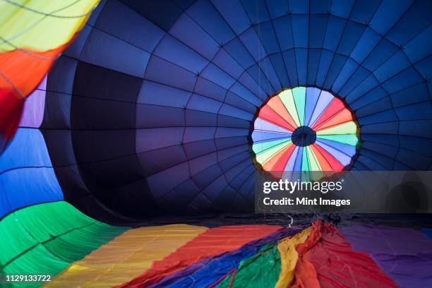hot air balloon being inflated - inside balloon photos et images de collection