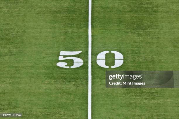 50 yard line - american football field top view stock pictures, royalty-free photos & images