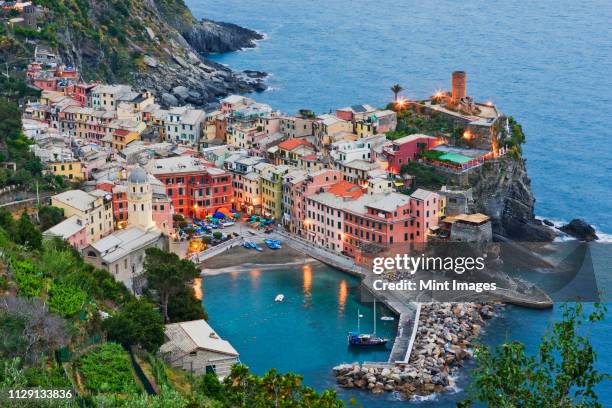 elevated view of vernazza at dusk - liguria stock pictures, royalty-free photos & images