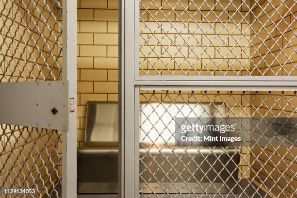empty jail holding cell - releasing stock pictures, royalty-free photos & images