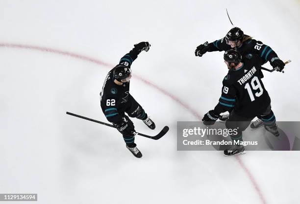 An overhead view as Kevin Labanc, Joe Thornton and Marcus Sorensen of the San Jose Sharks celebrate scoring a goal against the Montreal Canadiens at...