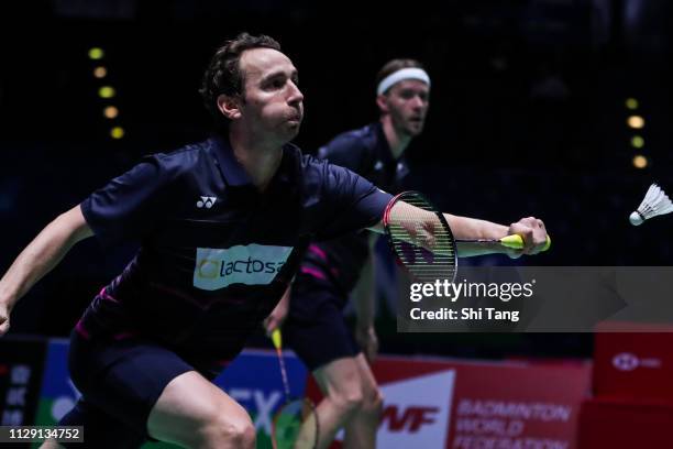 Mathias Boe and Carsten Mogensen of Denmark compete in the Men's Doubles second round match against Takeshi Kamura and Keigo Sonoda of Japan on day...