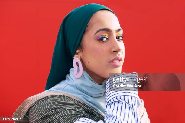 Portrait of young fashionable woman in hijab.