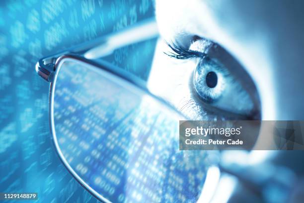 woman with computer screen reflecting in glasses - 2018 glasses ストックフォトと画像