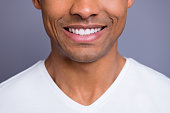Close-up cropped portrait of nice handsome attractive cheerful cheery well-groomed guy wearing white shirt beaming shine teeth isolated over gray violet purple pastel background