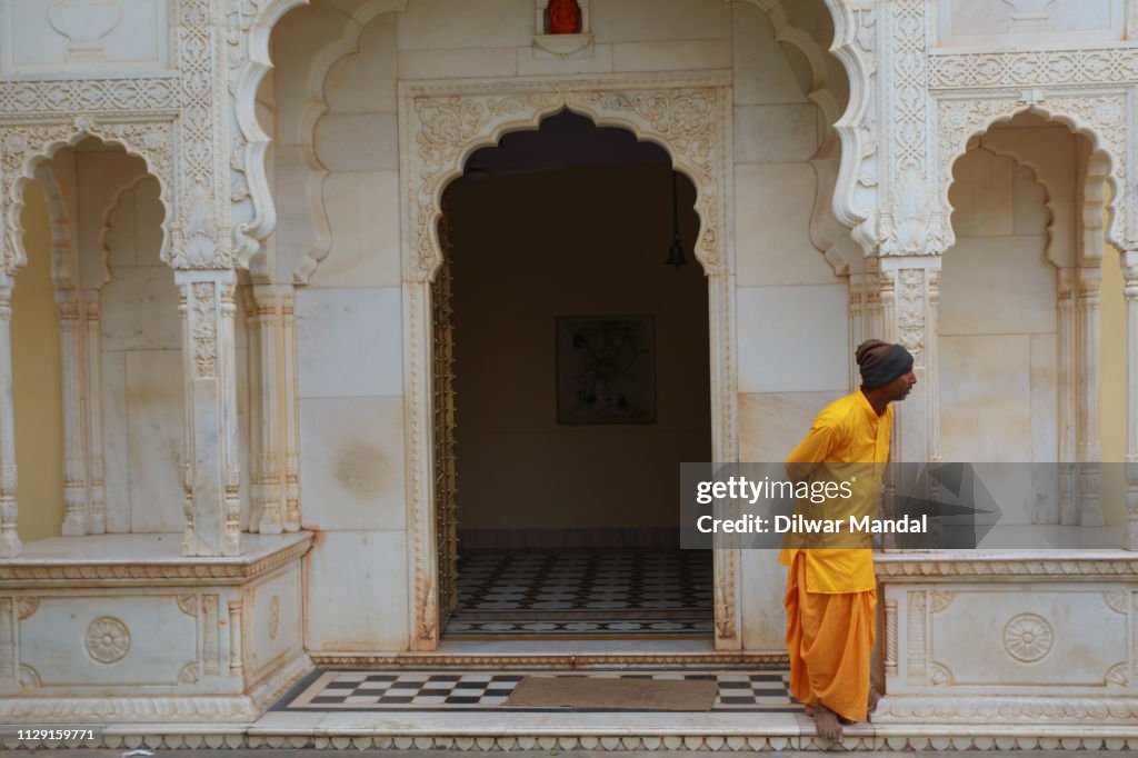 A Hindu priest looking outside