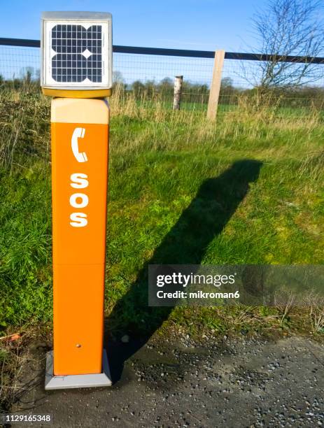 sos emergency road telephone box - emergency telephone box stock pictures, royalty-free photos & images