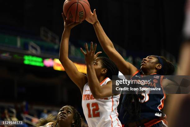 Syracuse Orange guard Kiara Lewis shoots the ball with Virginia Cavaliers guard Jocelyn Willoughby trying to block from behind during the ACC Women's...