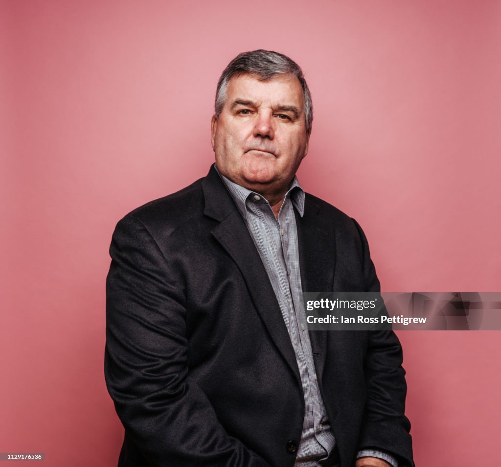Middle-aged Businessman on Pink background