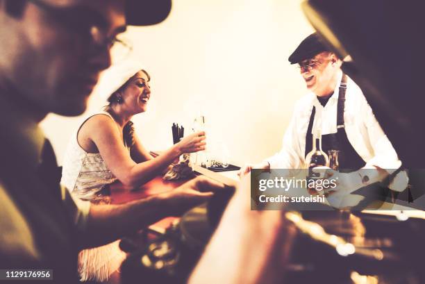 get your glasses up! - speakeasy stock pictures, royalty-free photos & images